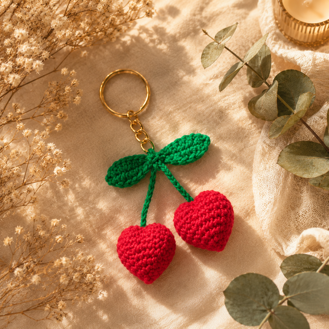 Handmade crochet heart cherry keychain with golden keyring made from premium cotton yarn.